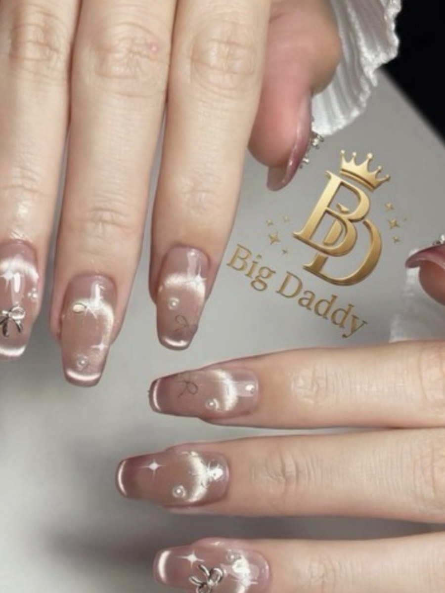Gel nail extensions with charms